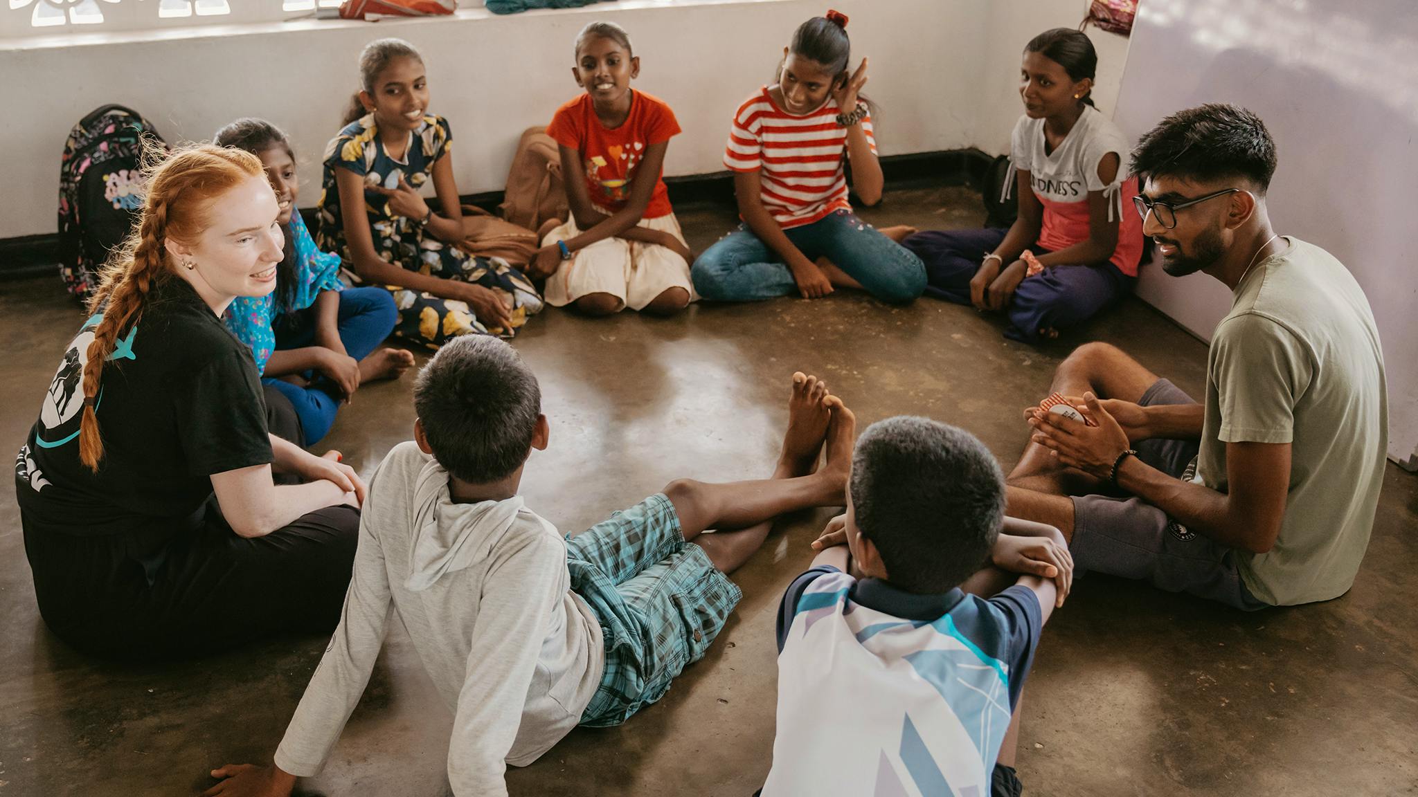Volunteers helping children